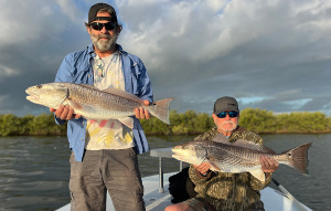 family group trip redfish double up